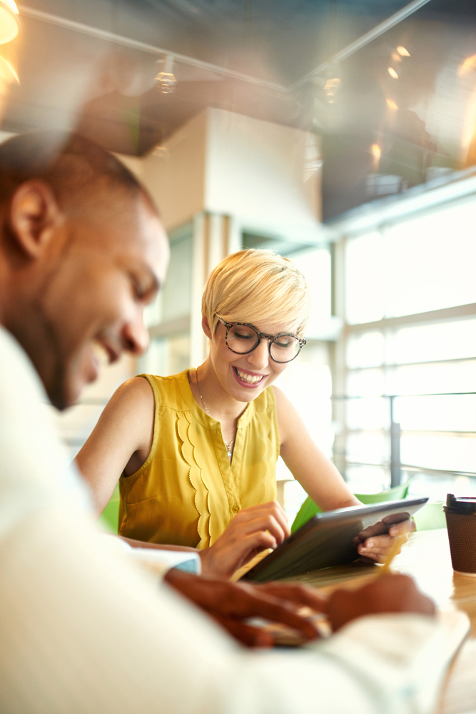 a business man and woman comparing electricity